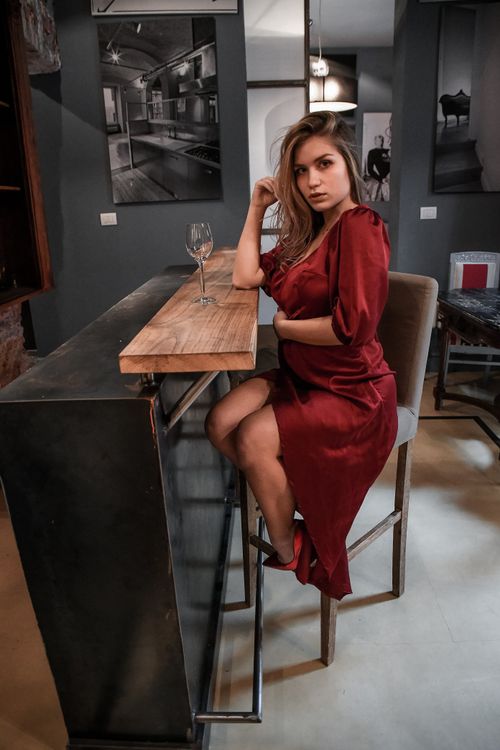 Woman in red Dress Sitting on a Chair · Free Stock Photo