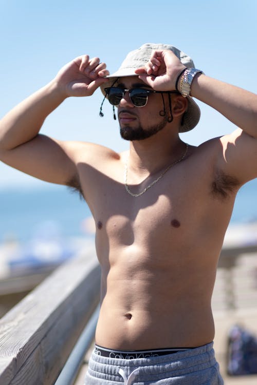Topless Man Wearing a Hat