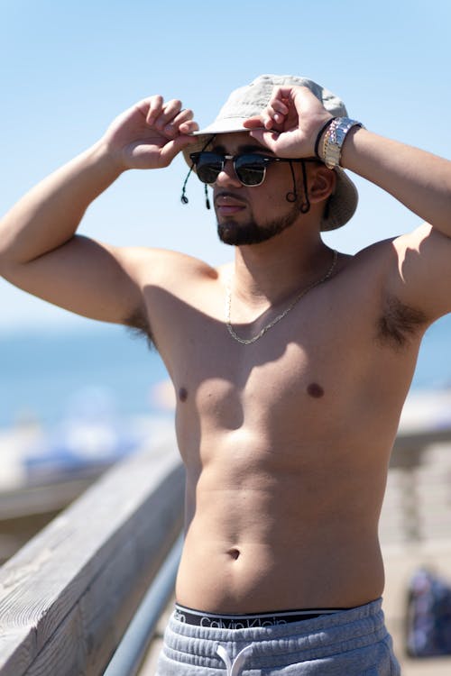 Shirtless Person Wearing a Hat