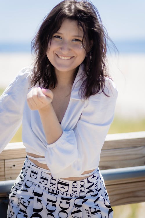 A Young Woman in White Long Sleeves