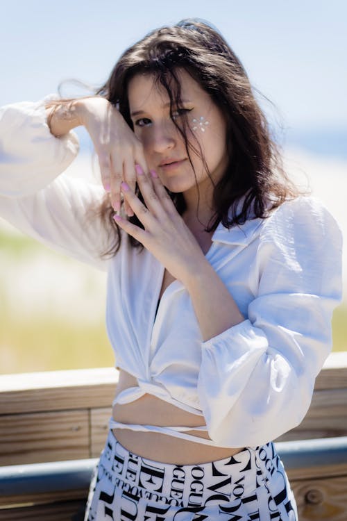 A Young Woman in White Long Sleeves