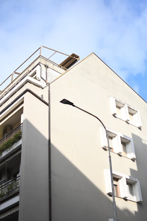 White Concrete Building Under the Blue Sky