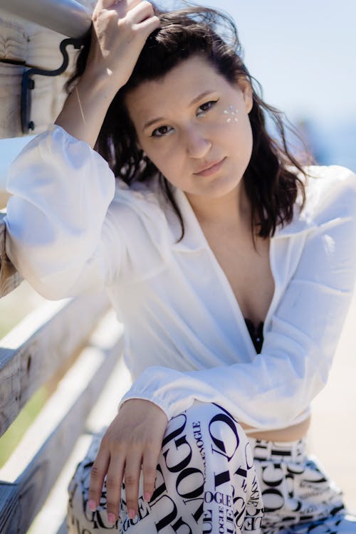 A Young Woman in White Long Sleeves