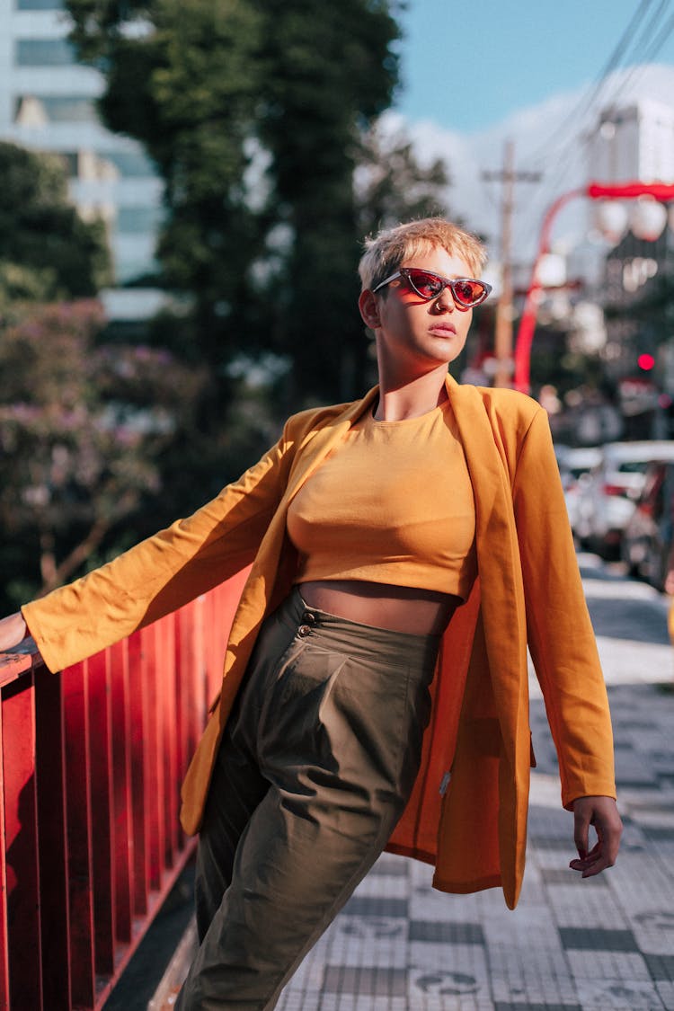 Woman Posing By Barriers In City