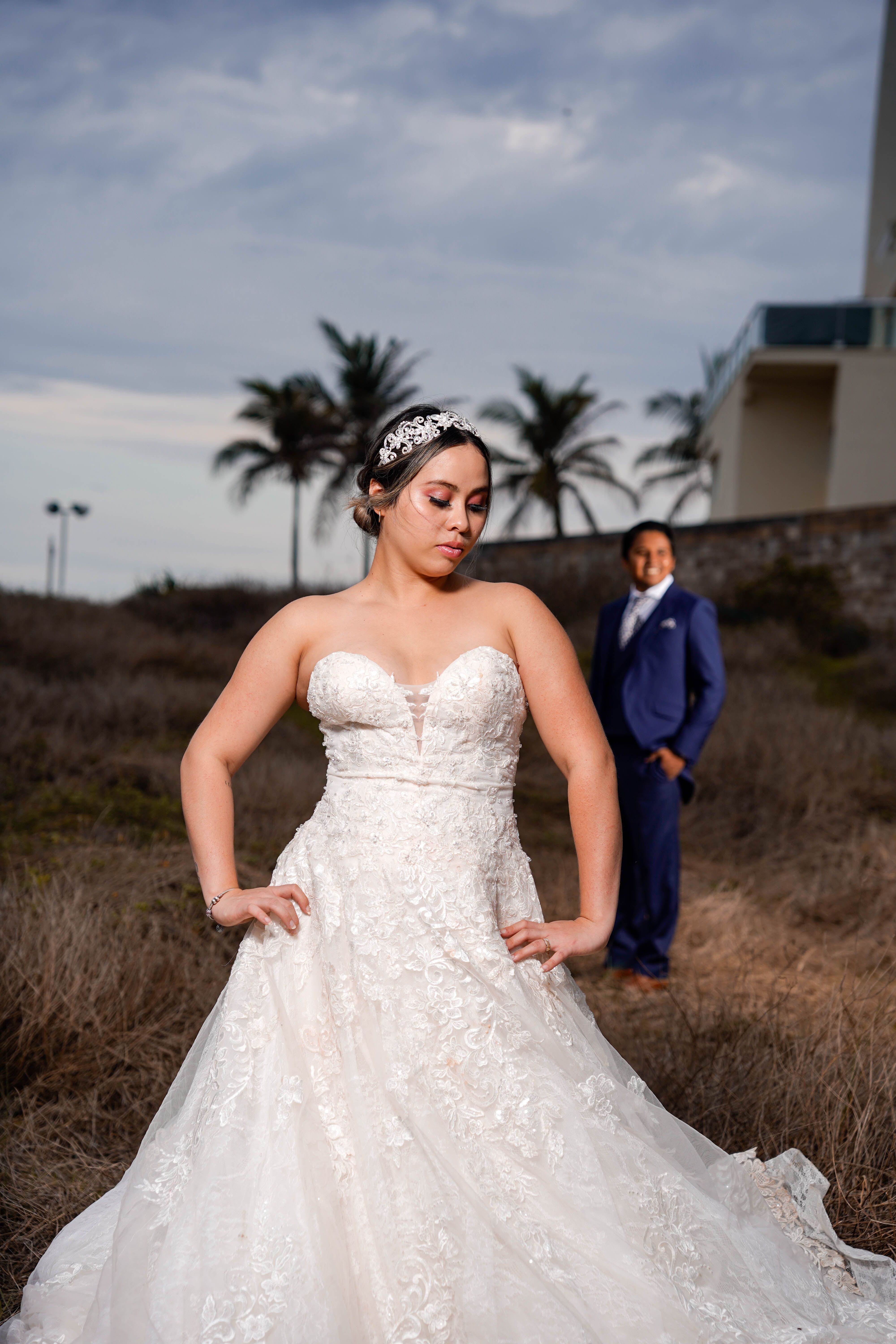 Woman In White Wedding Dress Standing On Rock · Free Stock Photo