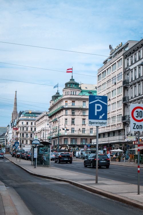 Free Elegant Viennese street view featuring classic architecture and city life around Opernring. Stock Photo