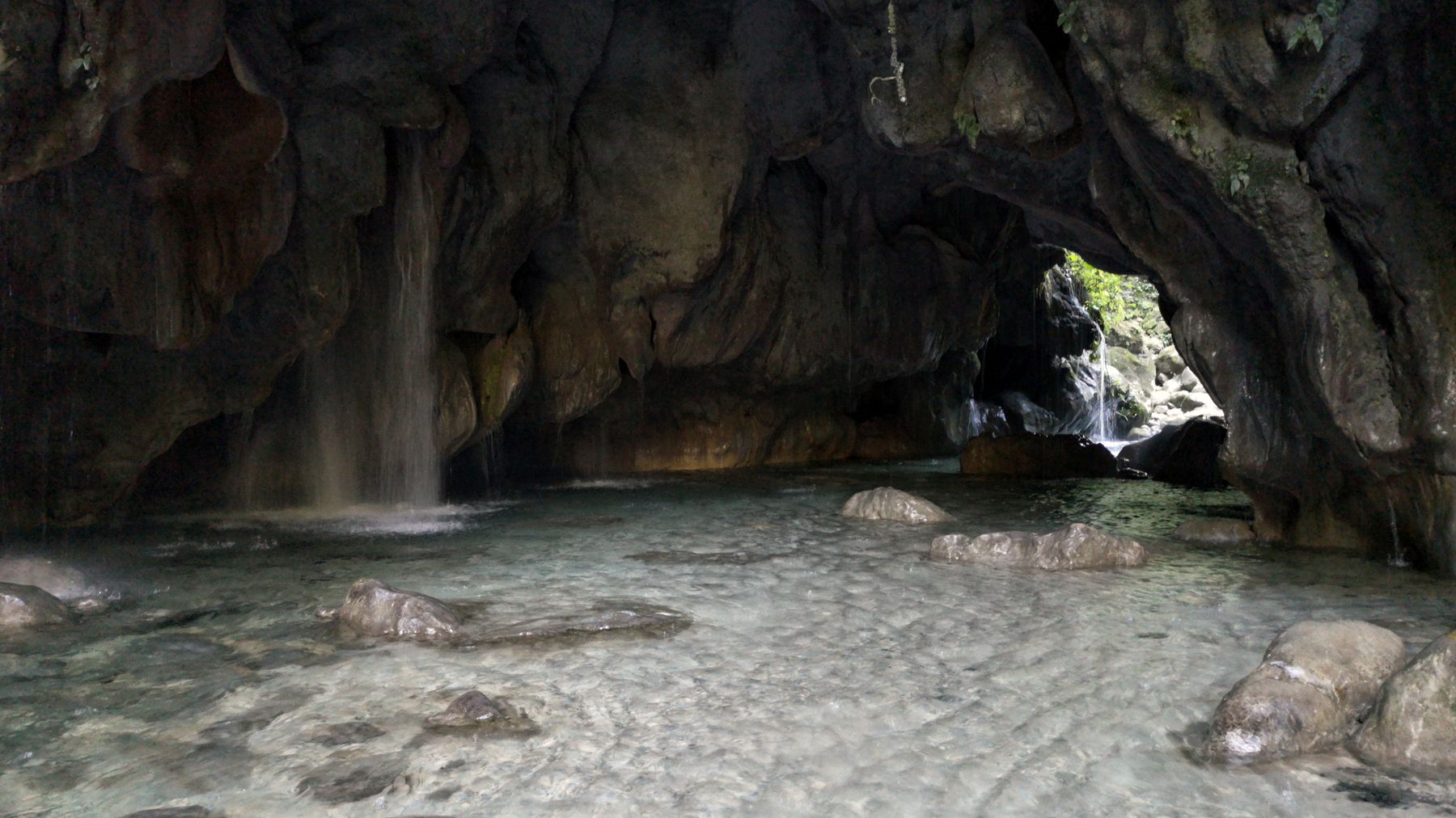 Discover the tranquil beauty of a natural grotto and waterfall in Pinal de Amoles, Mexico.