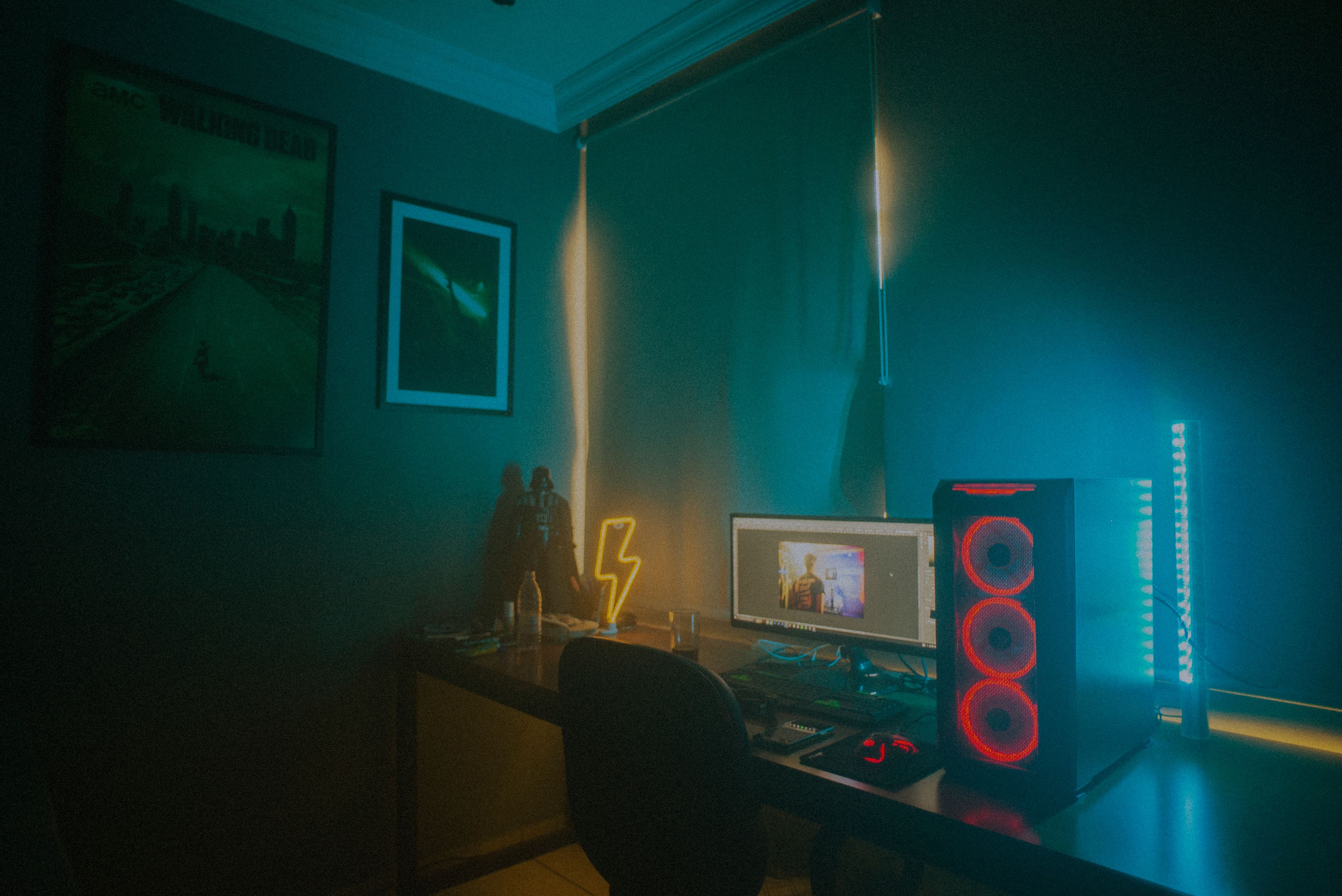 Moody gaming setup lit with neon