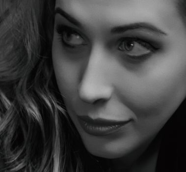 Close-up black and white portrait showcasing a woman's elegant features in Kyiv.
