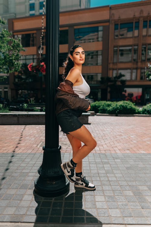 Woman Posing by Street Lamp