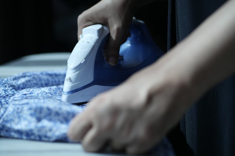 A Person Ironing Cloth