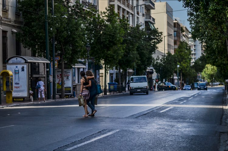 Women Walking On The Street Together