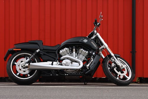 A Black Motorcycle Parked on the Street