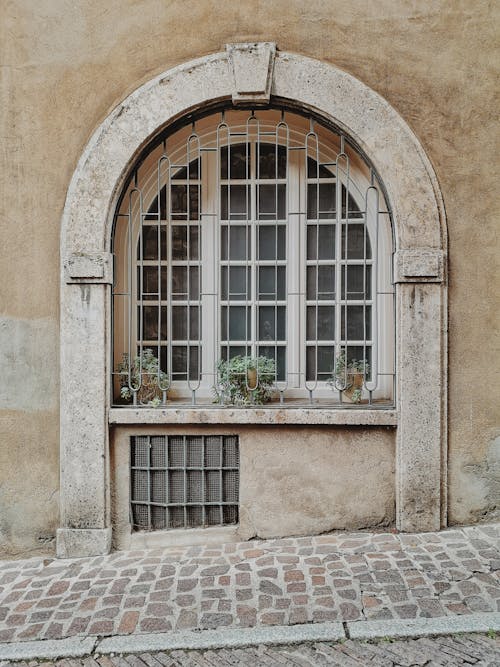 Window on Old Stone Wall on Street