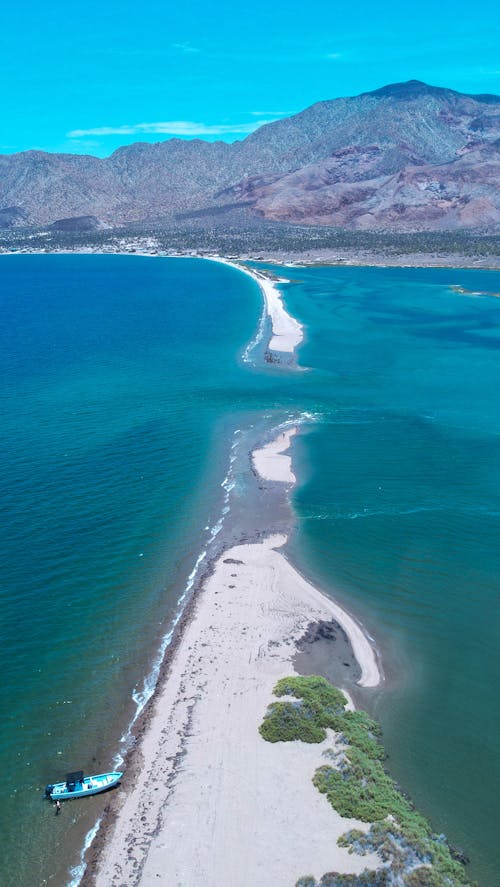 An Aerial Photography of an Island Between the Ocean