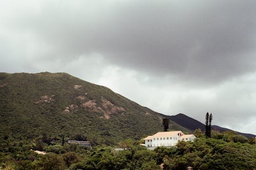 White House on Mountain with Moody Sky