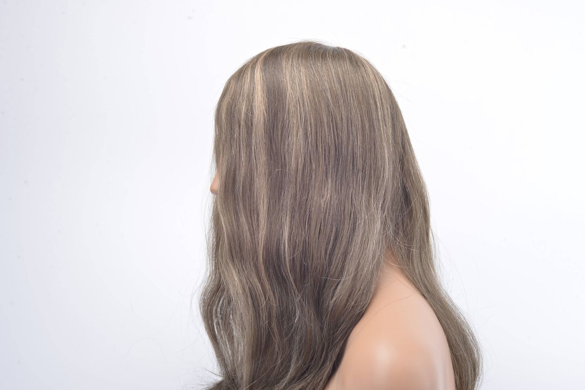 Long wavy hairpiece showing temporary extension length and texture