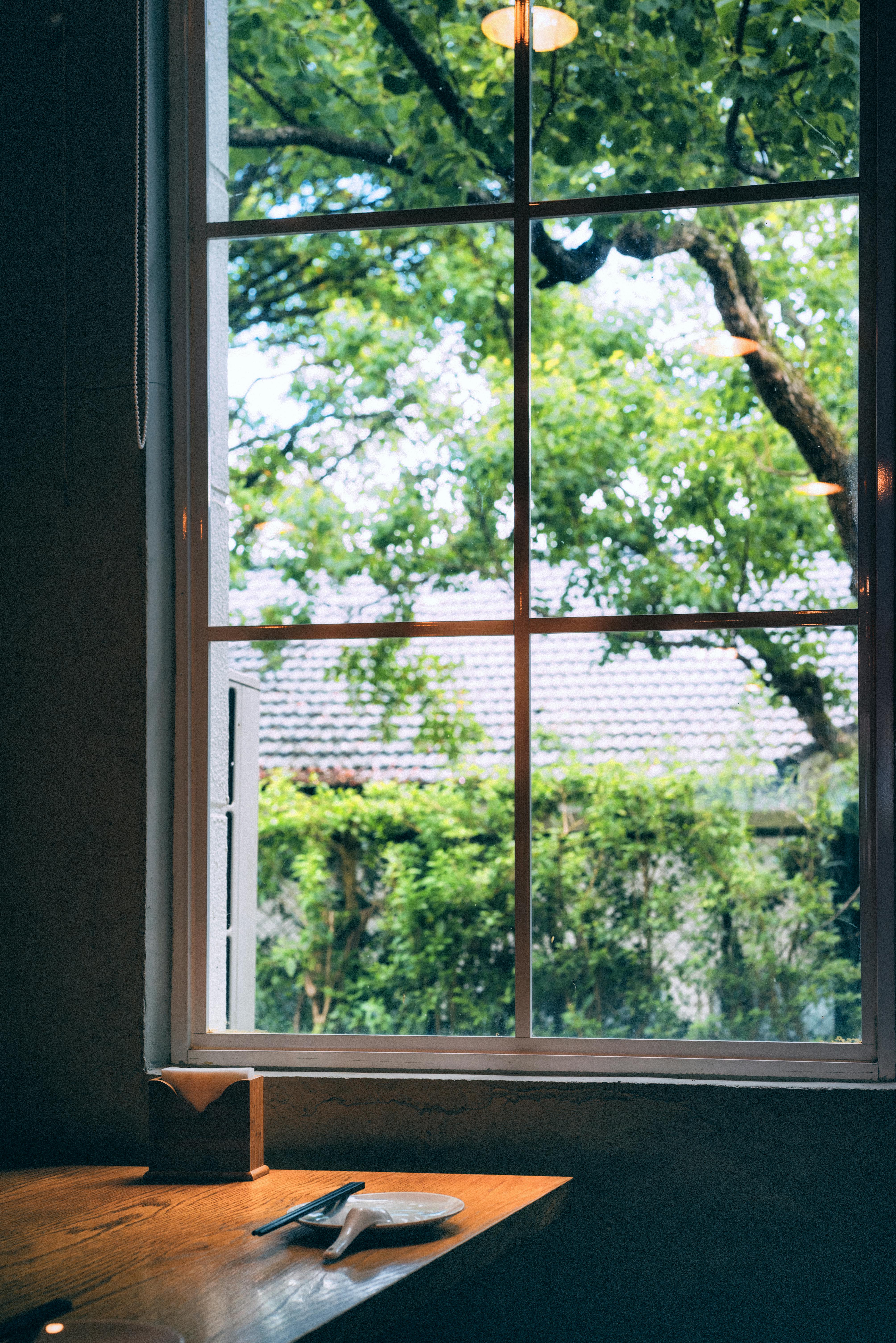 Wooden Table by the Window · Free Stock Photo