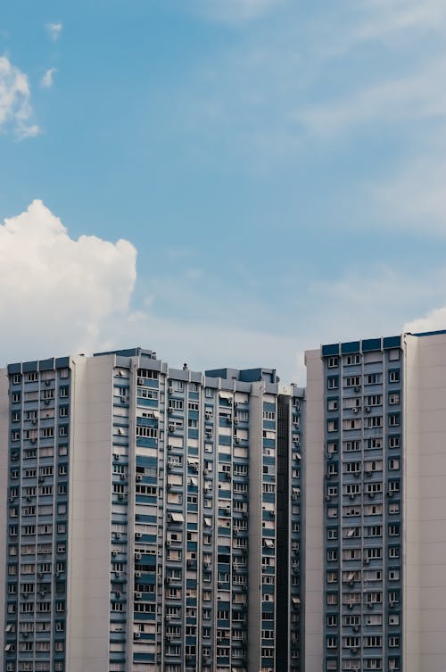 White and Blue Concrete Buildings Under the Blue Sky