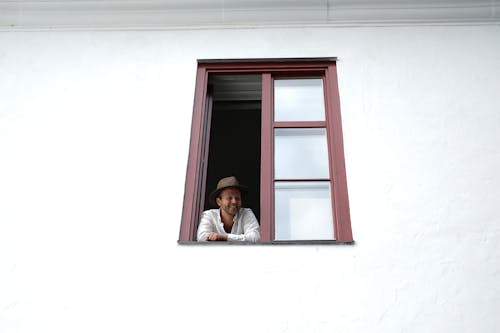 Person Looking Through Window