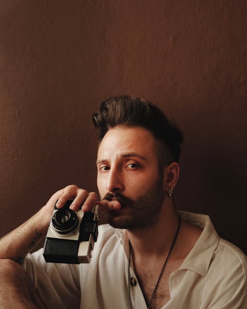 Free Portrait of Man Posing with Camera Stock Photo