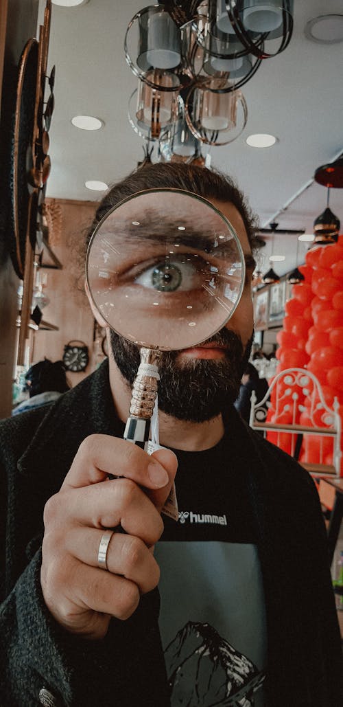 Man Holding a Magnifying Glass