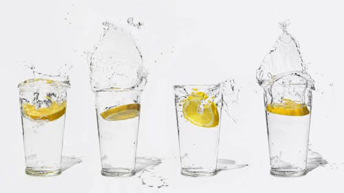 Free Splash of Water From Clear Drinking Glasses Stock Photo