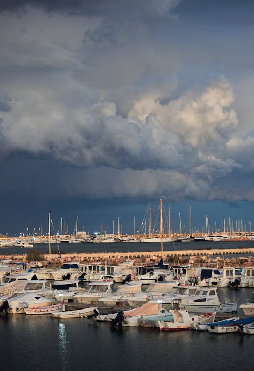 Boats on Dock Under Cloudy Sky