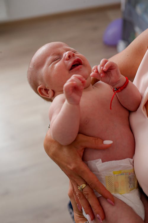 Free Person Holding Baby on White Diaper Stock Photo