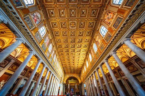 Free Stunning view of the ornate ceiling and architecture of a basilica in Rome, Italy. Stock Photo