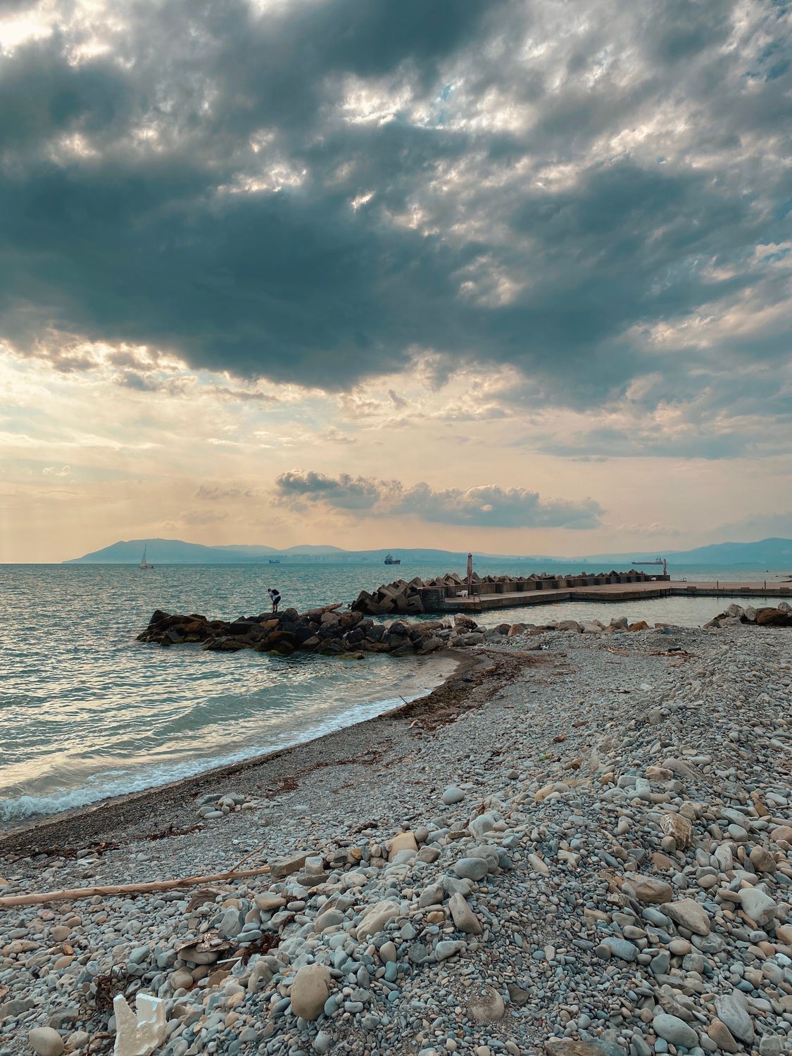 Rocky Shore Under Cloudy Sky · Free Stock Photo