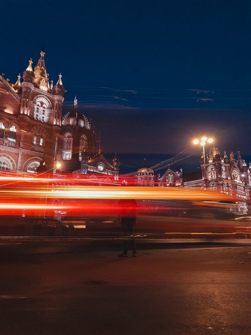 Free Stunning nighttime view of Chhatrapati Shivaji Terminus in Mumbai with vibrant light trails capturing the urban hustle. Stock Photo