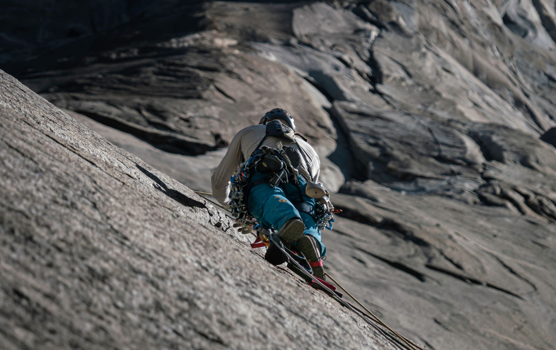 A climber skillfully tackles a challenging rock face, embodying adventure and determination.