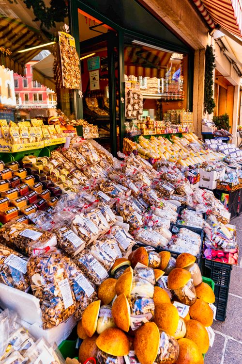 Free Colorful market stall showcasing dried food and local goods in a European setting, perfect for culinary exploration. Stock Photo