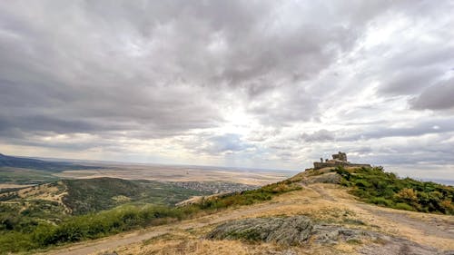 Free Scenic Landscape against a Cloudy Sky  Stock Photo