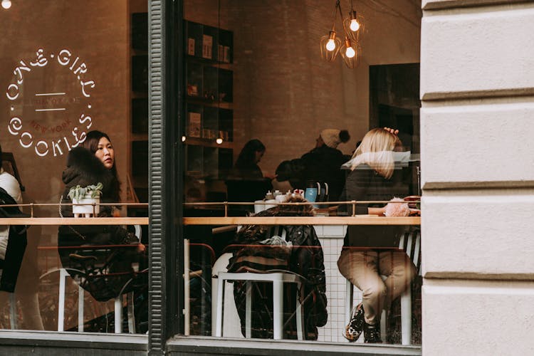 People Sitting On Chair In Restaurant