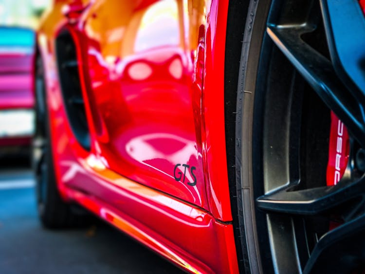 Close Up Photo Of A Red Shiny Car