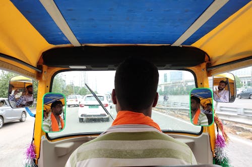 Man Driving a Tuctuc