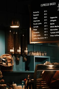 Cozy café setting with espresso-based menu and coffee beans display.