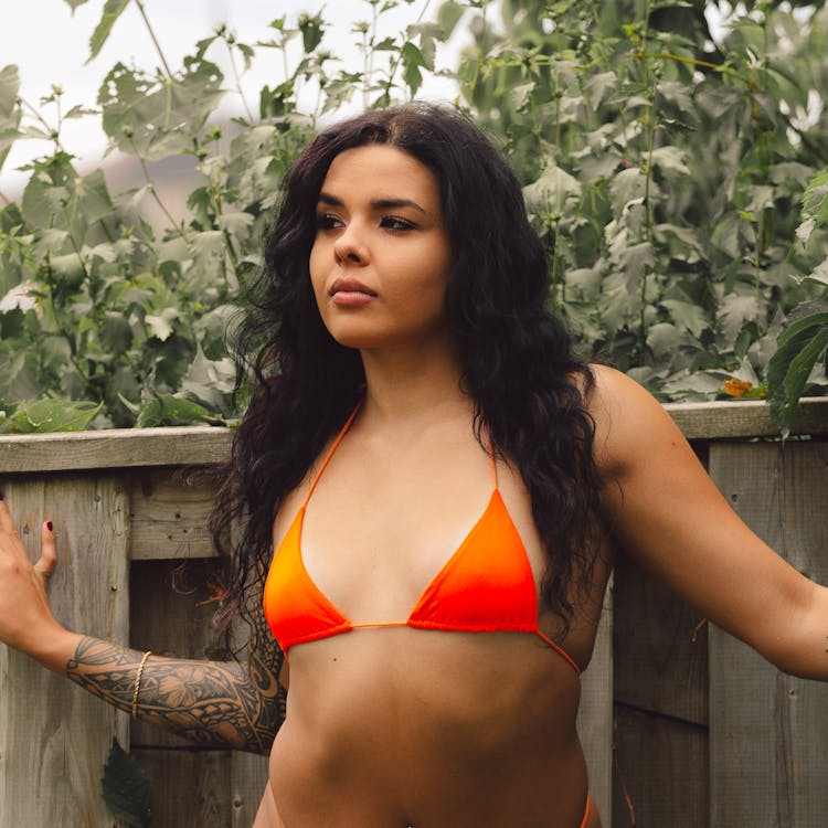 Close-Up Shot Of A Woman In Orange Bikini