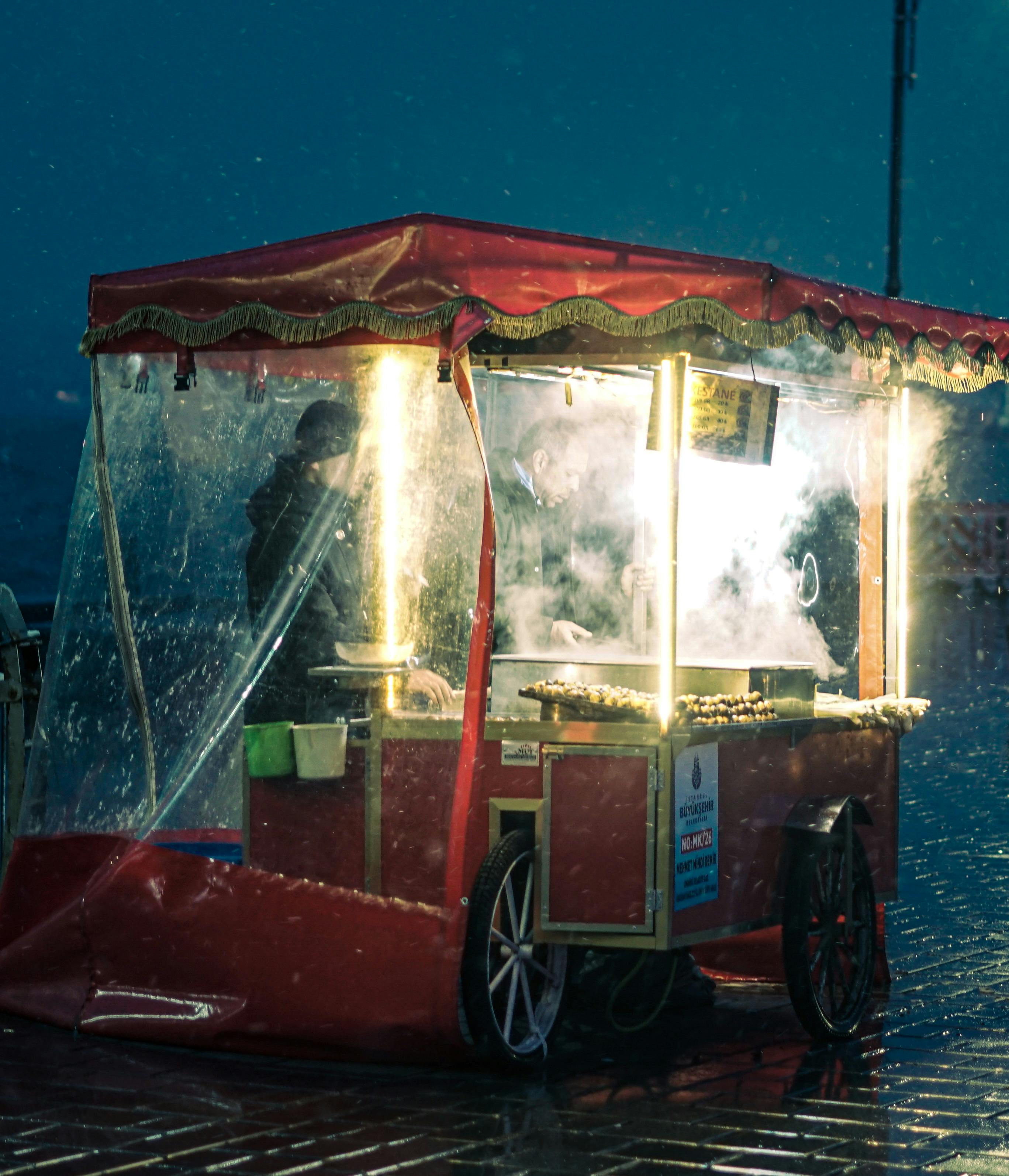 food vendors on the street during rainy day