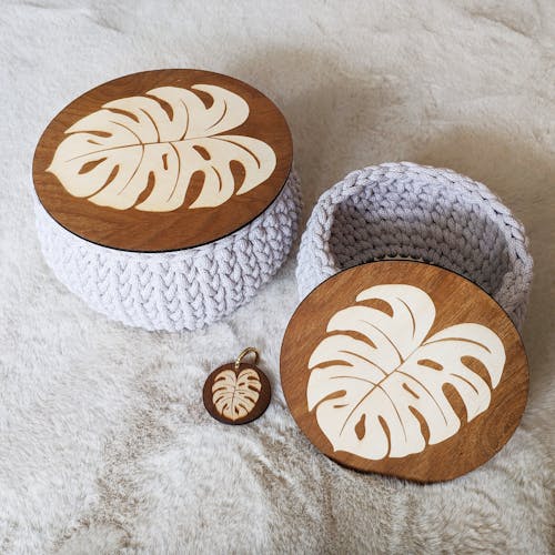 Woven Yarn Baskets with Wooden Lids with an Illustration of a Monstera Leaf