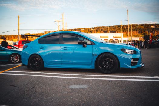 Blue Subaru Parked in a Parking Lot