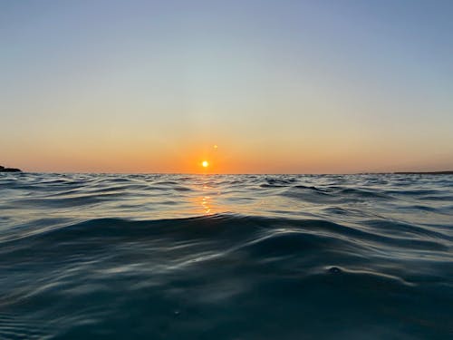 Free Scenic View of the Sunset and the Sea Stock Photo