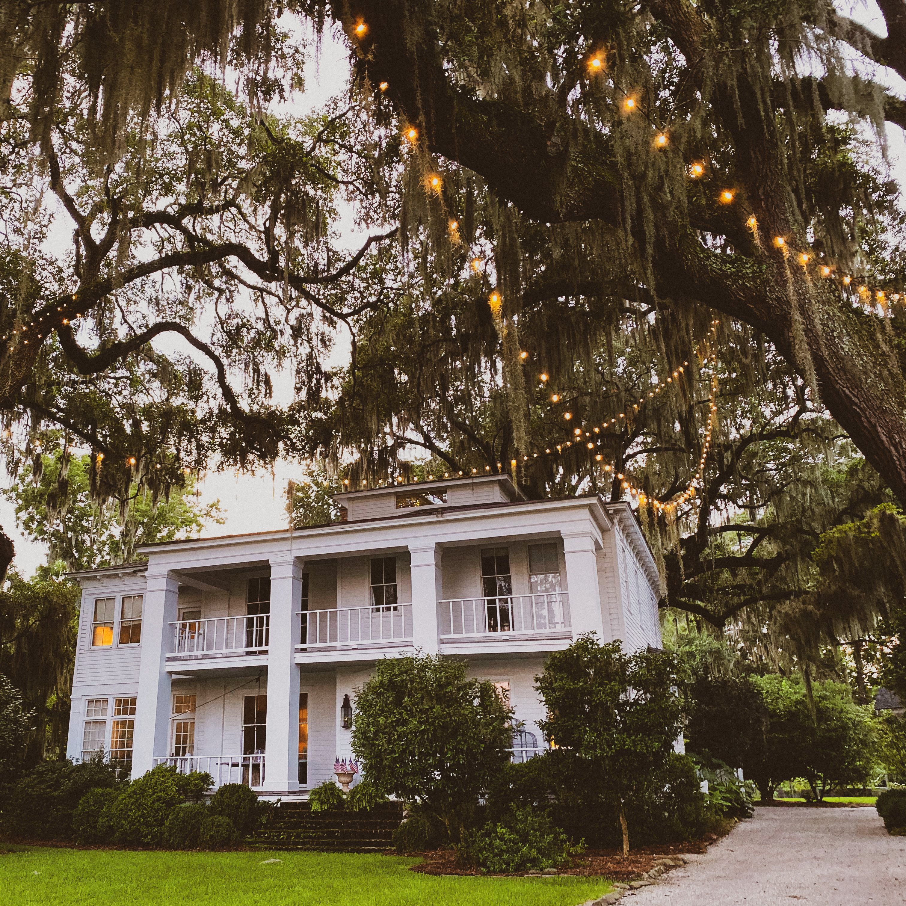 White Concrete House Near Green Trees · Free Stock Photo