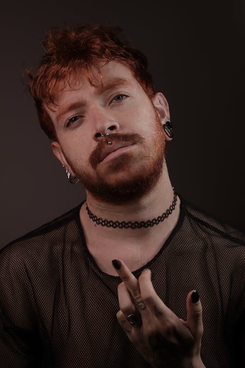 Red Haired Man Posing in Mesh T-Shirt and Choker