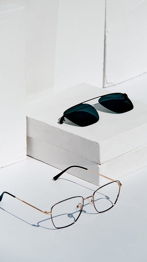 Free Black Sunglasses on White Table Stock Photo