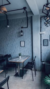 Stylish restaurant interior with modern decor and minimalist furniture in a cozy atmosphere.