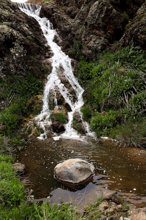 Scenic View of a Cascade in the Mountains