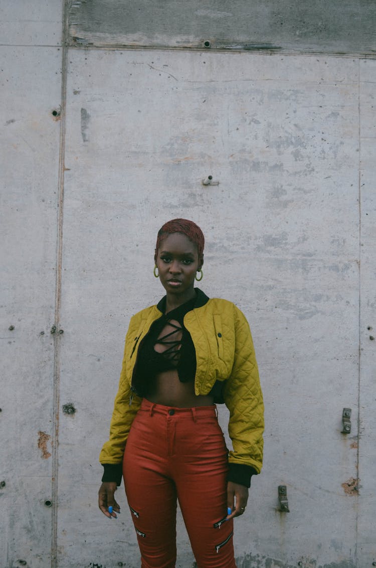 African American Fashion Model Wearing Yellow Short Jacket And Red Pants